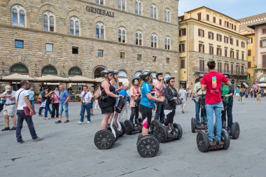 Tourists visiting the city during their guided Segway clipart
