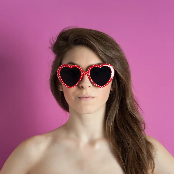 Beautiful girl with heart glasses — Stock Photo, Image