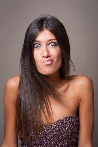 Brunette woman portrait with crazy expression. — Stock Photo, Image