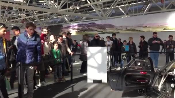 People visiting Motor Show Pagani pavillion — Stock Video