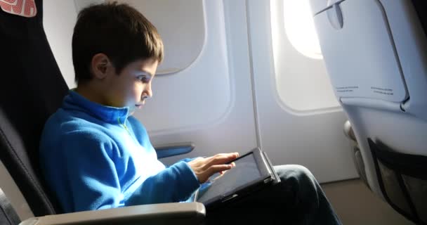 Kid relaxing using tablet — Stock Video