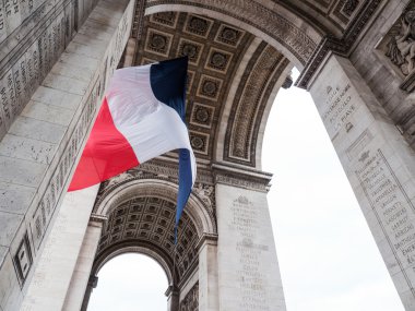 Arch of Triumph in Paris with flag