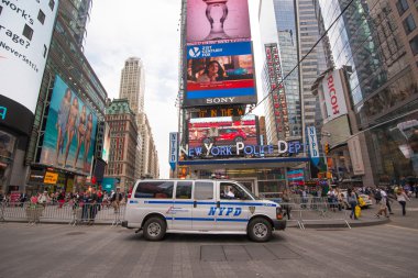 NYPD van and sign at Times Square in New York clipart