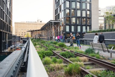 People walking on the High Line Park in New York clipart