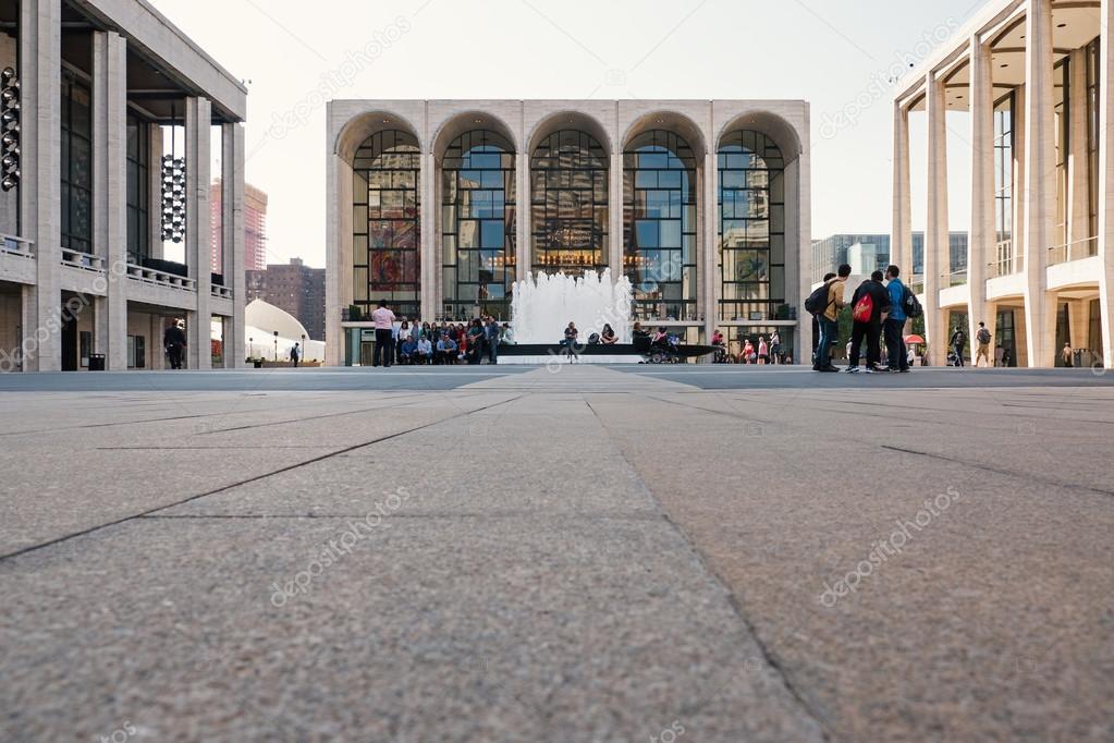 NEW YORK CITY, MAY 2015. People in front of Lincoln Center building. Lincoln Center for the Performing Arts is a 16.3-acre complex of buildings in the Lincoln Square neighborhood of Manhattan.