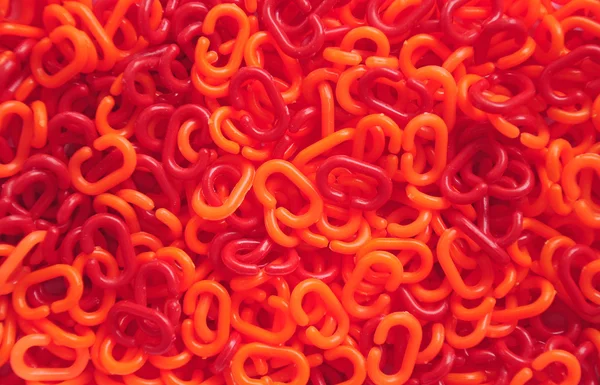 Red and orange plastic chain — Stock Photo, Image