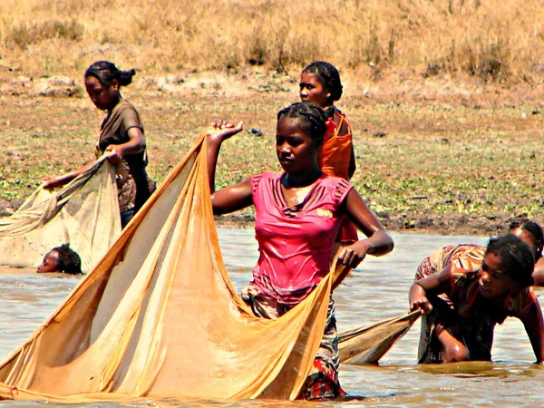 A young girl is fishing