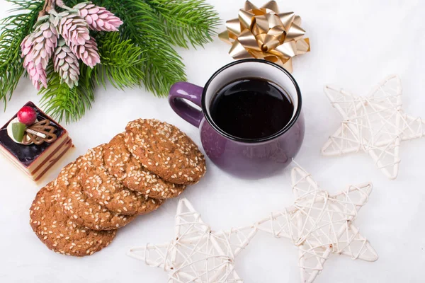 Christmas holiday Breakfast. A Cup of coffee and ginger cookies with sweets