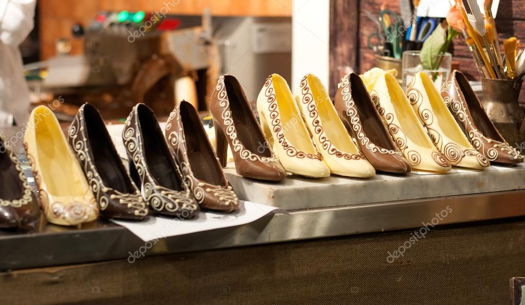 Different chocolate shoes on the table — Stock Photo © vikslove