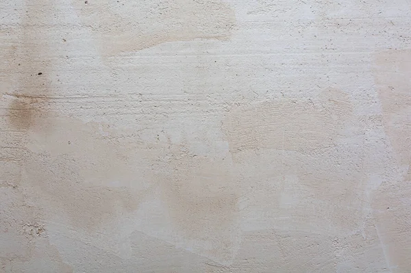 Wet white gypsum plaster. Abstract background and texture of gypsum plaster.