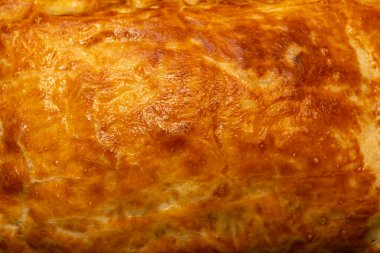 Kızarmış hamur dokusu arka planı. Kızarmış turta. Yakın plan..