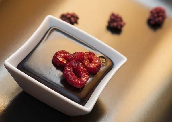 Chocolate dark Pudding with raspberries — Stock Photo, Image