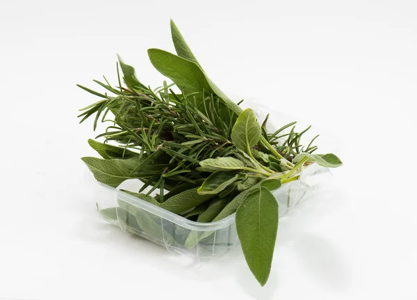 Mixed sage and rosemary in market package — Stock Photo, Image