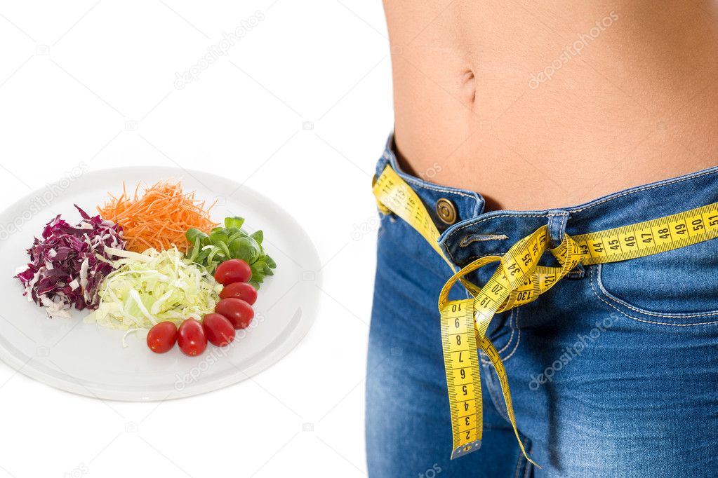 young girl wearing jeans after diet and food background