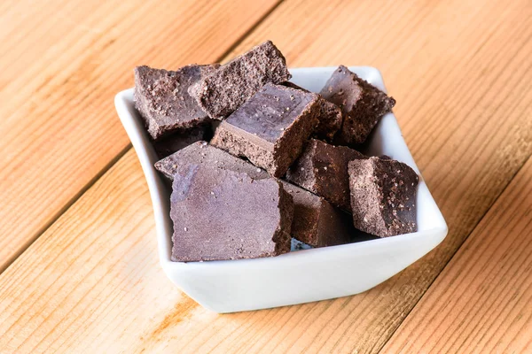 Raw chocolate in white cup — Stock Photo, Image