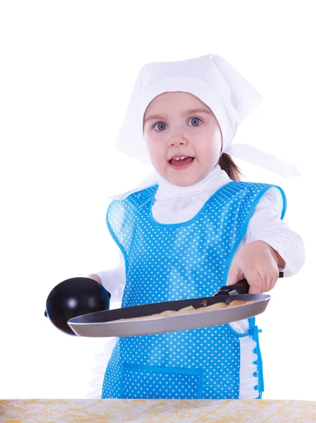 Liten flicka matlagning pannkakor — Stockfoto