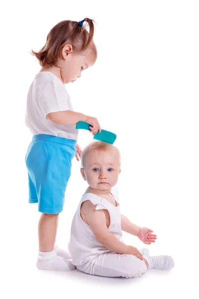 Children playing with comb.