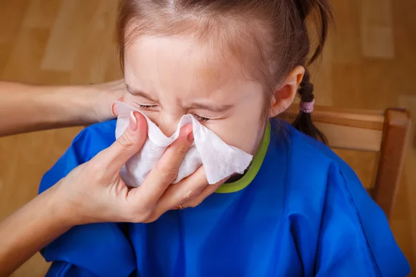 Little girl blowing her nose — Stock Photo, Image