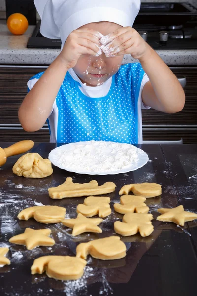 Cute little girl playing with a flour — Stock Photo, Image