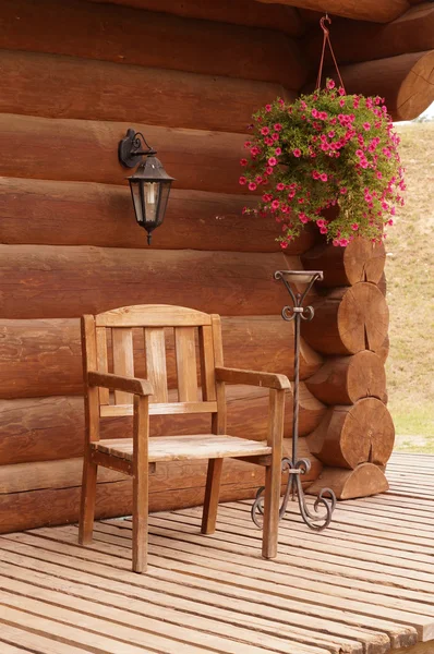 Wood chair wood house flowers — Stock Photo, Image