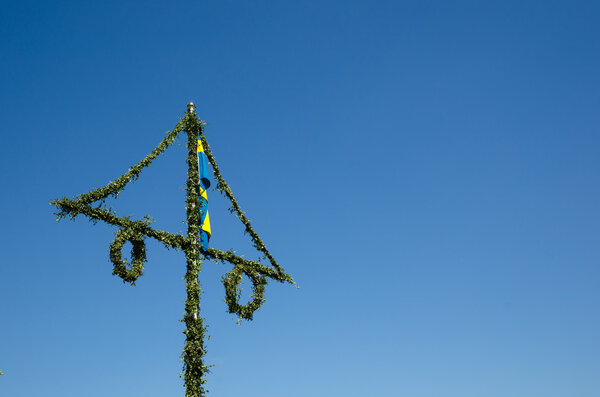 Midsummer pole at blue sky