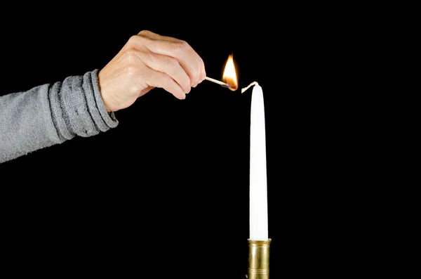 Lighting a candle — Stock Photo, Image