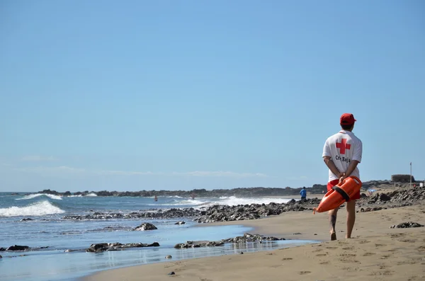 Lifeguard patrolling the beach — Stock Photo, Image