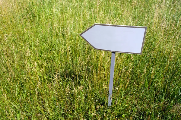 Empty pointer on grass — Stock Photo, Image