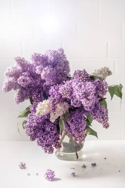 A bouquet of lilac on a light background. Shabby chic style. Soft focus. — 스톡 사진