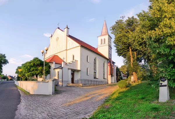 A small church at sunset in the city Dobzhen Wielki — Stock Photo, Image