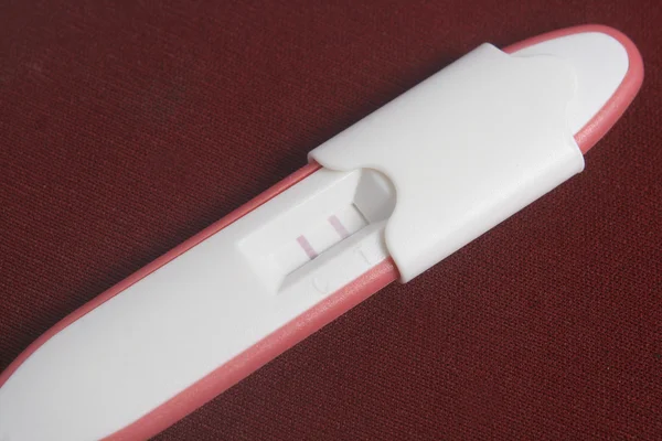 Pregnancy Test Pack At Dark Red Background — Stock Photo, Image