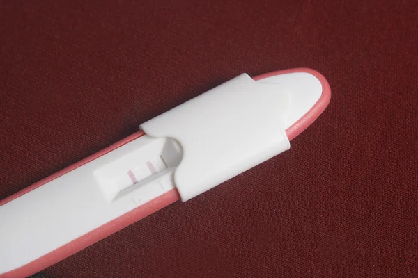 Pregnancy Test Pack At Dark Red Background — Stock Photo, Image