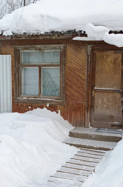 Snow-covered wooden house — Stock Photo, Image