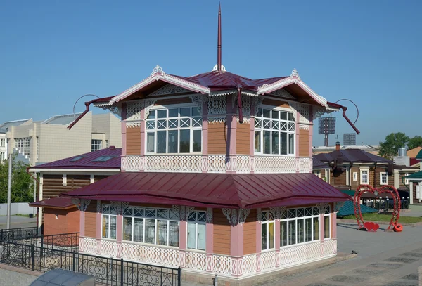 Two-storey wooden house with carved lacy pattern — Stock Photo, Image