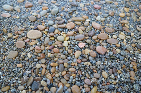 Farbige glatte Steine, die vom Baikalsee geschickt poliert wurden — Stockfoto
