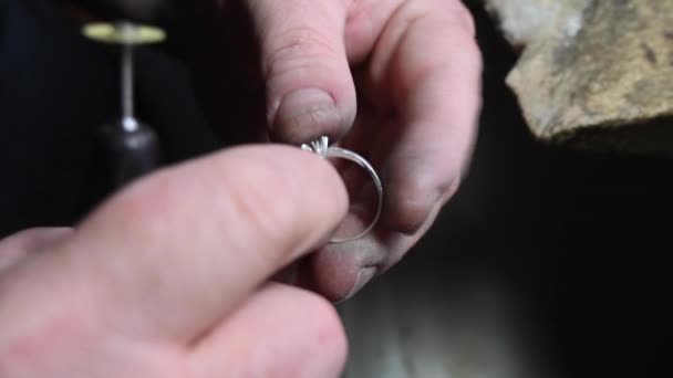 Closeup of wedding ring polishing by caicasian jeweler isolated, 4k footage — Stock Video