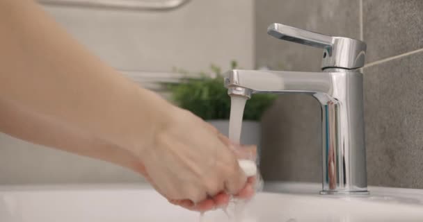 Coronavirus pandemic prevention wash hands with soap warm water rubbing fingers washing frequently or using hand sanitizer gel. Slow motion — Stock Video