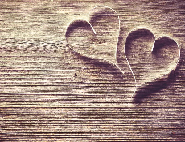 Wooden background with hearts Royalty Free Stock Images