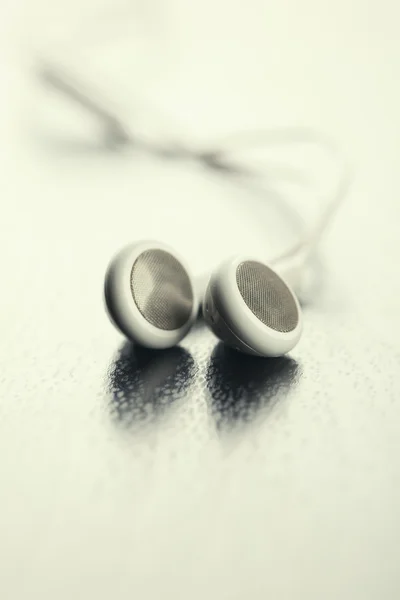 White Earphones on table — Stock Photo, Image