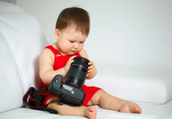 Baby met camera Stockfoto