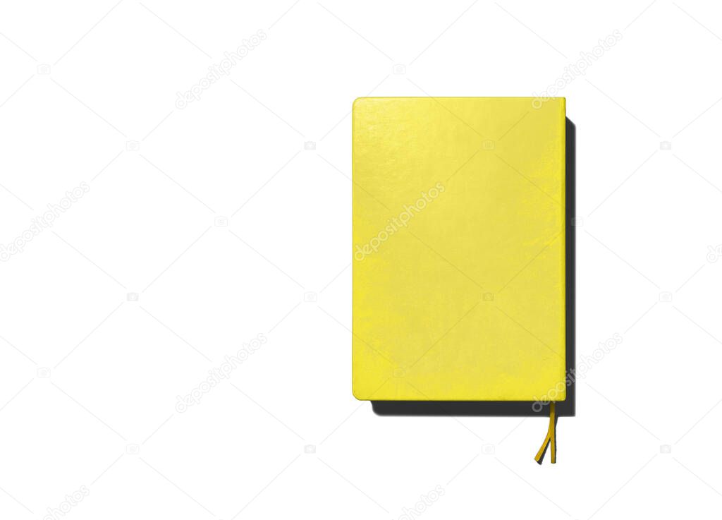 yellow closed notepad with bookmark on white background, template, place for text