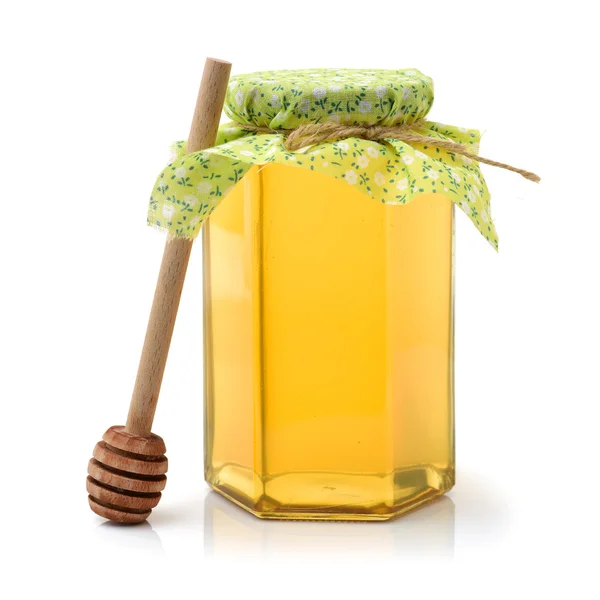 Honey bottle with stick — Stock Photo, Image