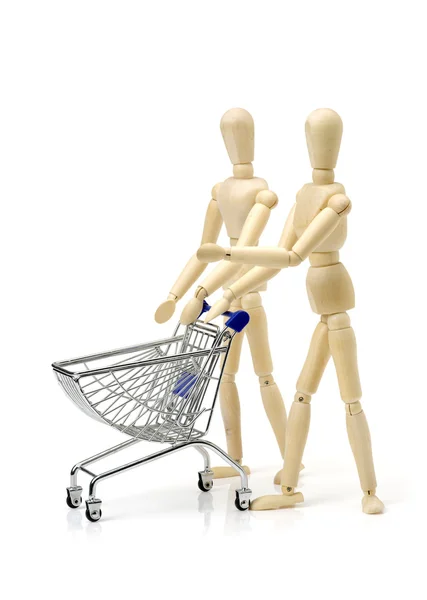 Shopping concept. Wooden doll and — Stock Photo, Image