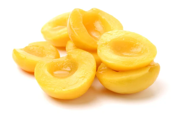 Canned peaches slices on white