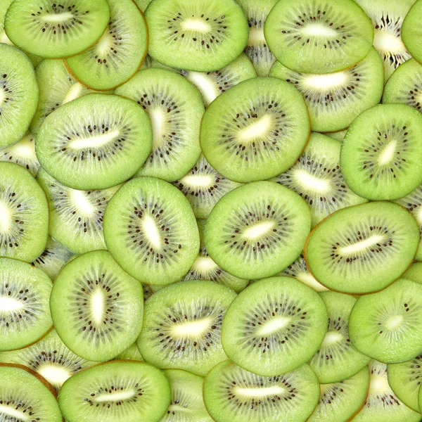 Kiwi segmenten als achtergrond — Stockfoto