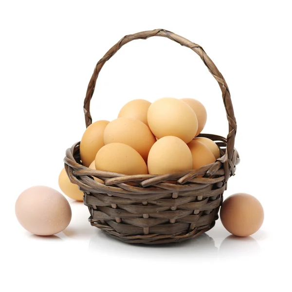 Raw eggs in basket — Stock Photo, Image