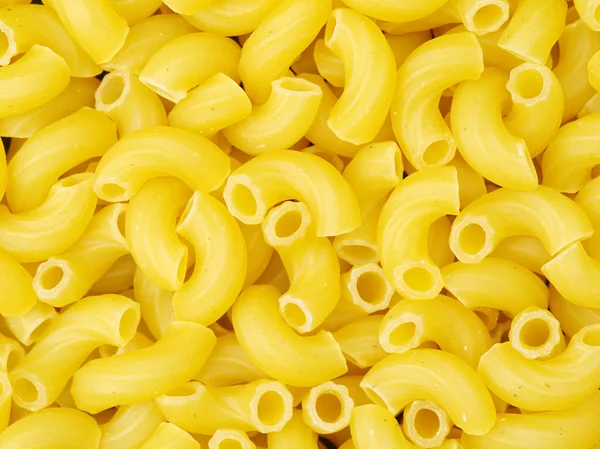 Golden pasta in pile — Stock Photo, Image
