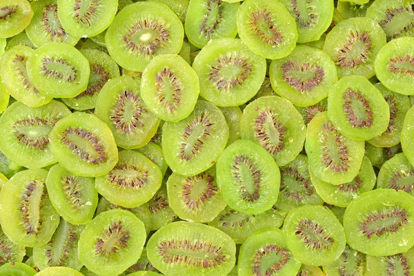 Kiwi slices as background — Stock Photo, Image