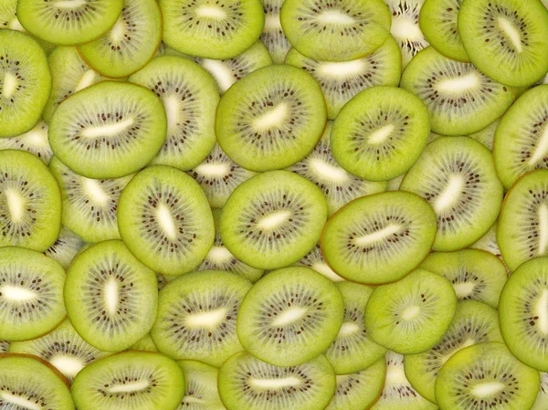 Fette di kiwi come sfondo — Foto Stock