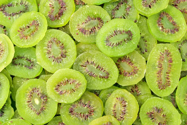 Kiwi slices as background — Stock Photo, Image